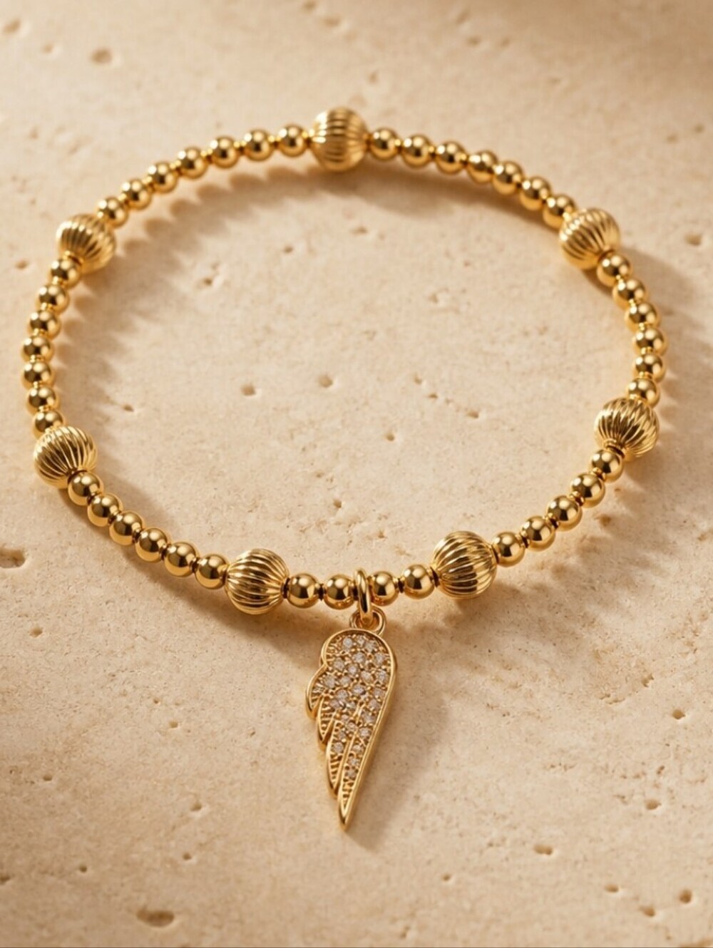 Gold Beaded Angel Wing Charm Bracelet